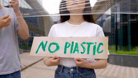 three  friends protesting against plastic 2