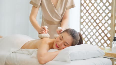 woman receiving a thai massage