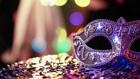 purple masquerade mask on sequins
