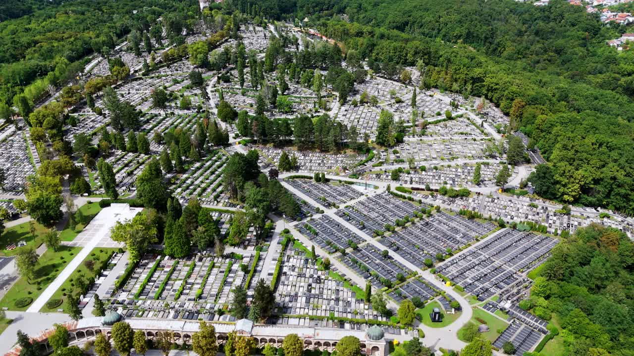 Aerial drone view of Mirogoj Cemetery in Zagreb, Croatia iconic arcades, green domes, and tree-lined paths forming one of Europe’s most beautiful memorial parks