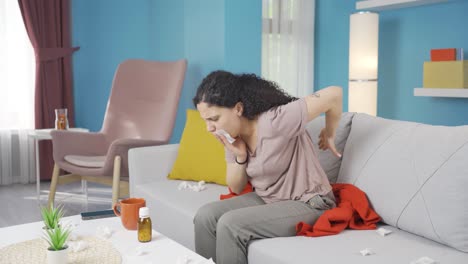 young woman covering her mouth and nose while coughing.