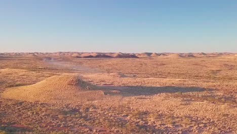 australian desert bush from aerial drone elevation towards fire