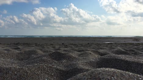 Stormy-sea,-windy-weather,-waves-on-the-beach,-cloudy-sky,-low-angles,-close-up