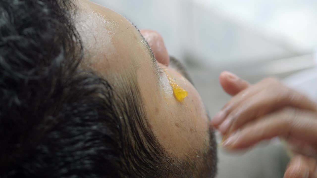 Man getting facial treatment