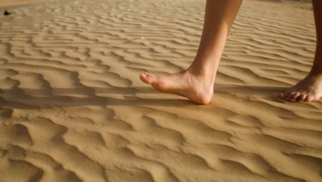 barefoot person on the sand