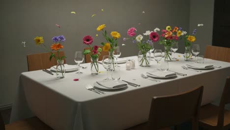 beautifully arranged table setting with vibrant flowers and elegant dinnerware, perfect for celebrations or special occasions