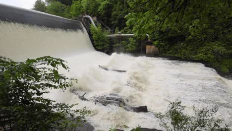 scenic shots of the cuyahoga river at gorge dam in summit county, ohio, where a man-made waterfall and reservoir meet a revitalized natural landscape near akron and cuyahoga falls.