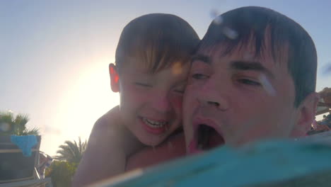 Father-teaching-son-to-dive-in-the-pool