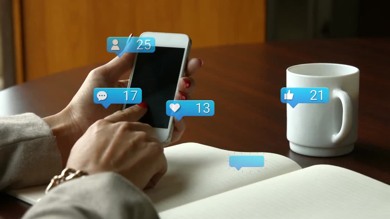 Animation of social media reactions over hands of caucasian woman using smartphone