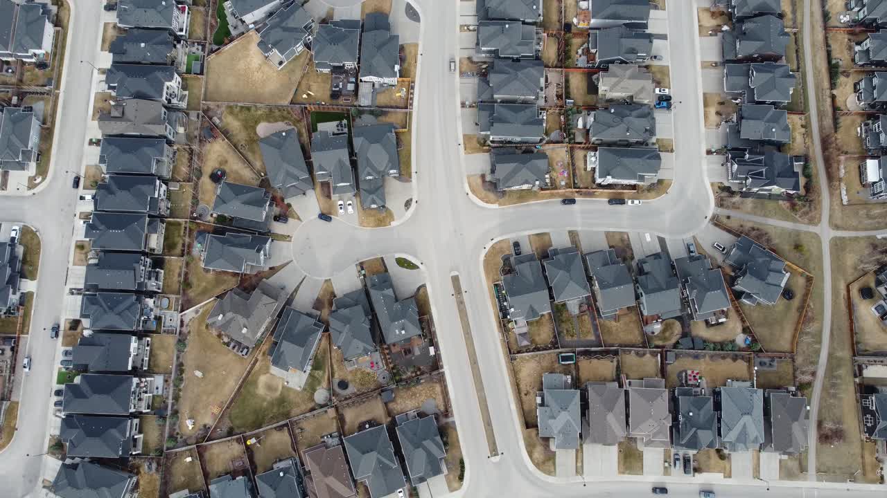 Aerial view of a modern suburban community in Calgary, Canada, in spring after the snow melt