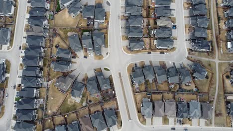 aerial view of a modern suburban community in calgary, canada, in spring after the snow melt