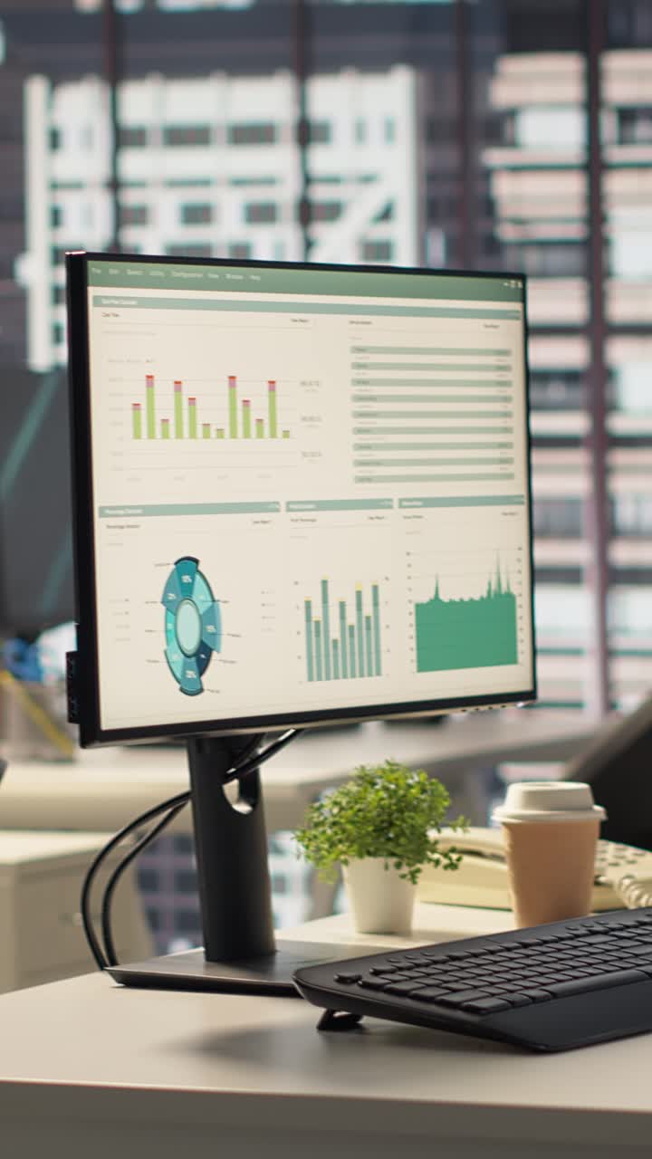 Empty Modern Office Desk with Computer Displaying Financial Data