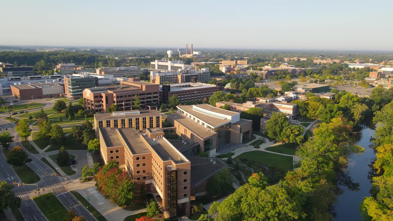 Michigan State University facility on sunny summer evening, aerial drone view