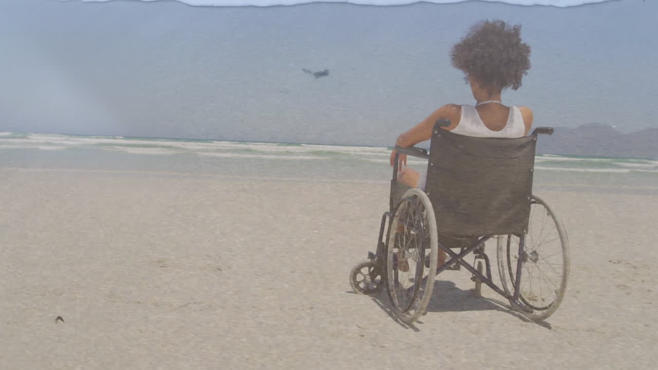 animación de paisaje marino sobre una mujer afroamericana discapacitada sentada en silla de ruedas