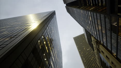 skyscrapers rise majestically into a cloudy sky over a bustling city landscape