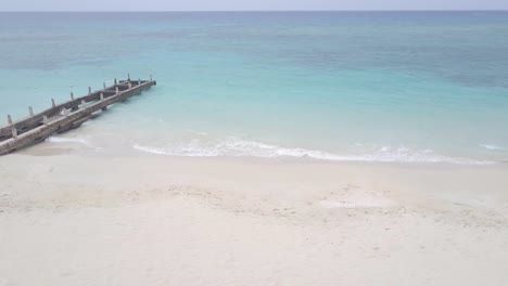 aerial view of jamaica white sand tropical beach with sea ocean, umbrella and chair on private resort beach with no people