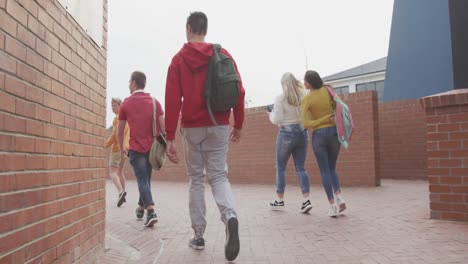 friends going outside at the end of the high school