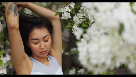 asian woman in spring flowers