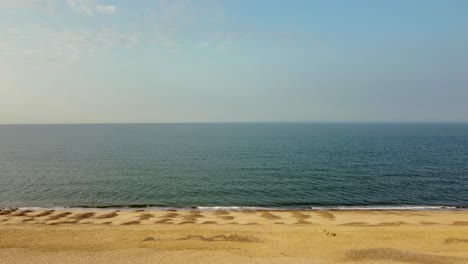 aerial - slowly flying over beach towards ocean, eccles, norfolk