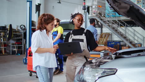 Mechanic-does-checkup-on-client-car