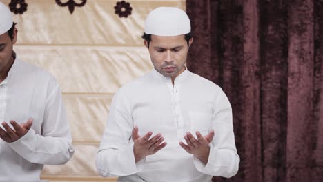 indian muslim man reading namaz at home