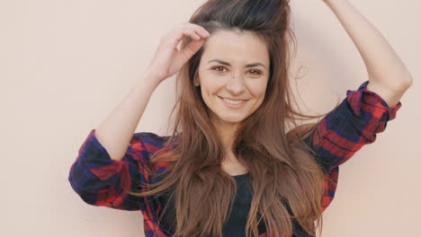 woman wearing plaid shirt posing outdoors