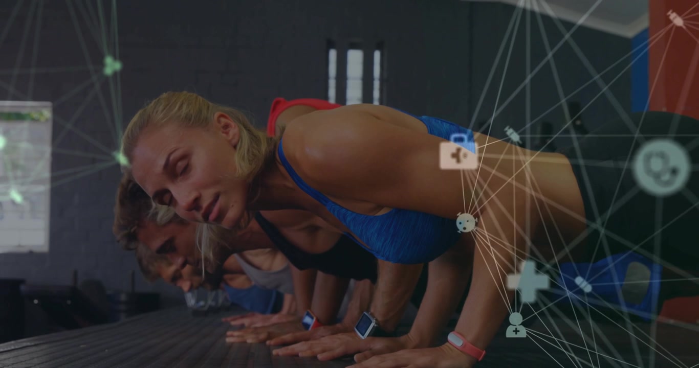 Fitness crew doing pushups in training node overlaying torso, camera zooming on lead woman turning