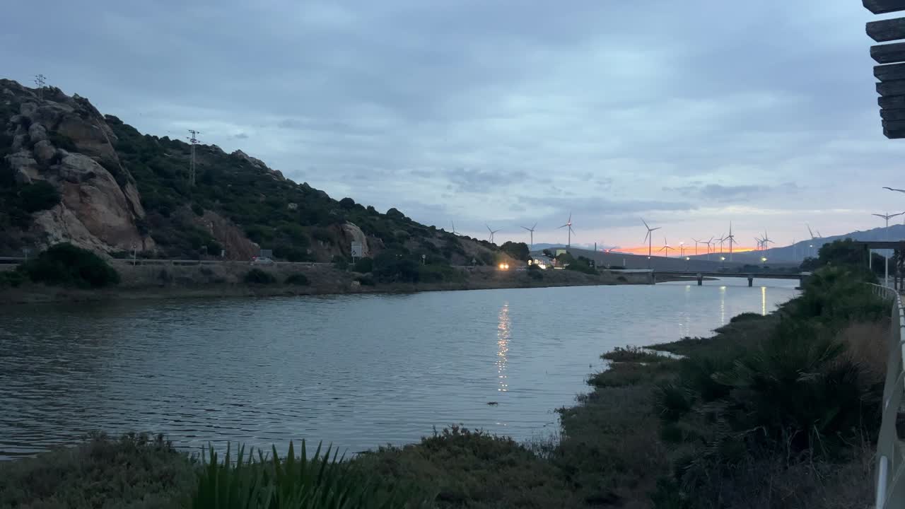 Wide View of Water Channel with Highway at Sunset