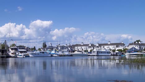 white clouds timelapse over boats in marina