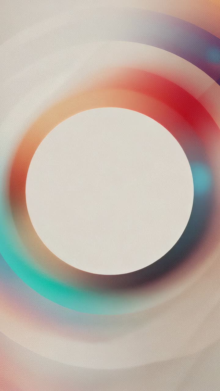 Vertical video: At start, colorful rings rotating around central white disk in gradient background