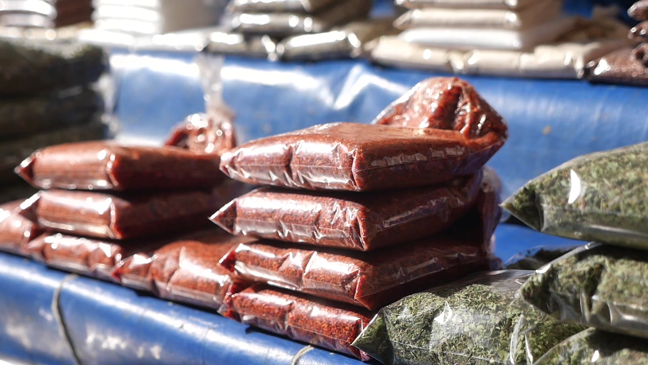 Close-up of Spices and Herbs in Plastic Bags at Market