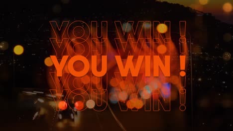 animation of you win text over glowing spot lights