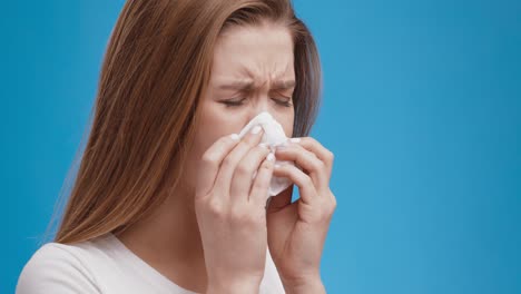 woman blowing nose