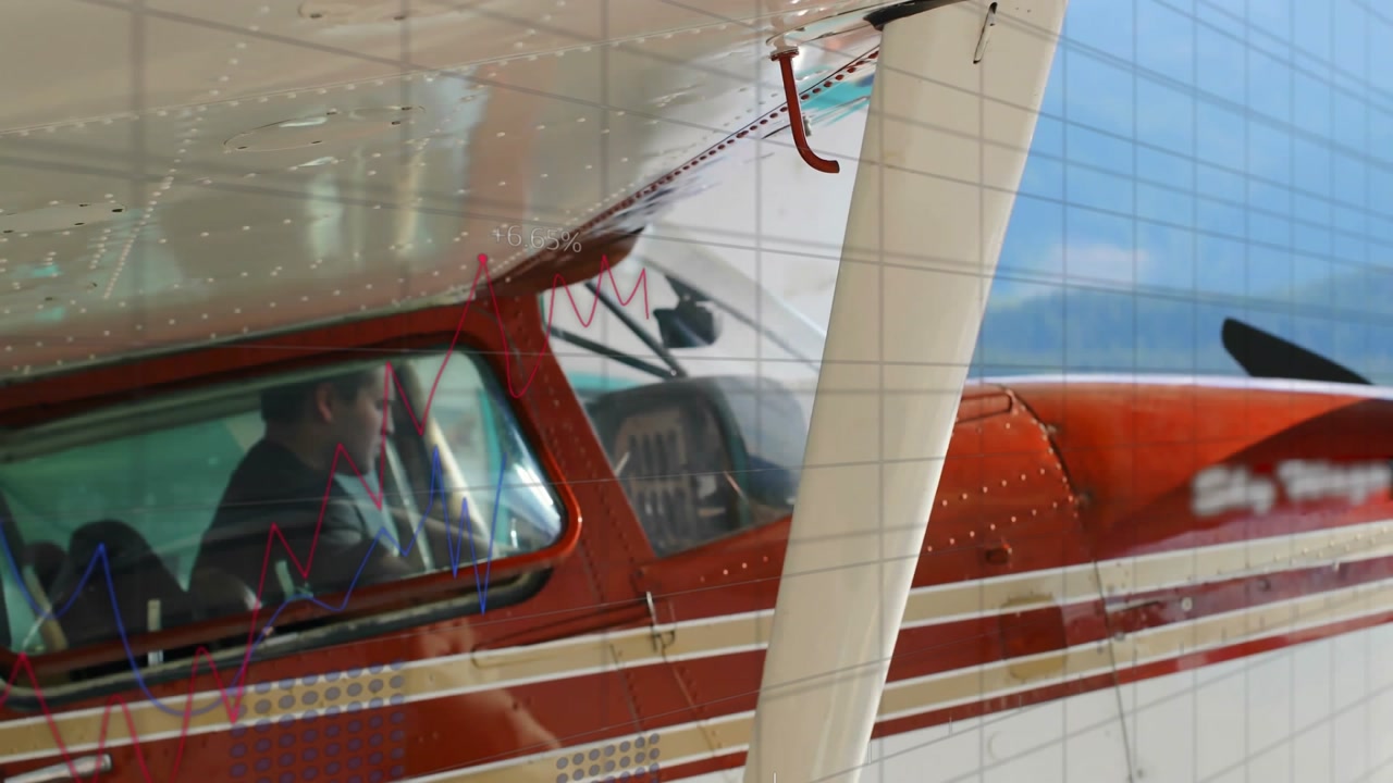 Pilot adjusting mic and using aviation radio layer while checking cockpit gauges awaiting clearance