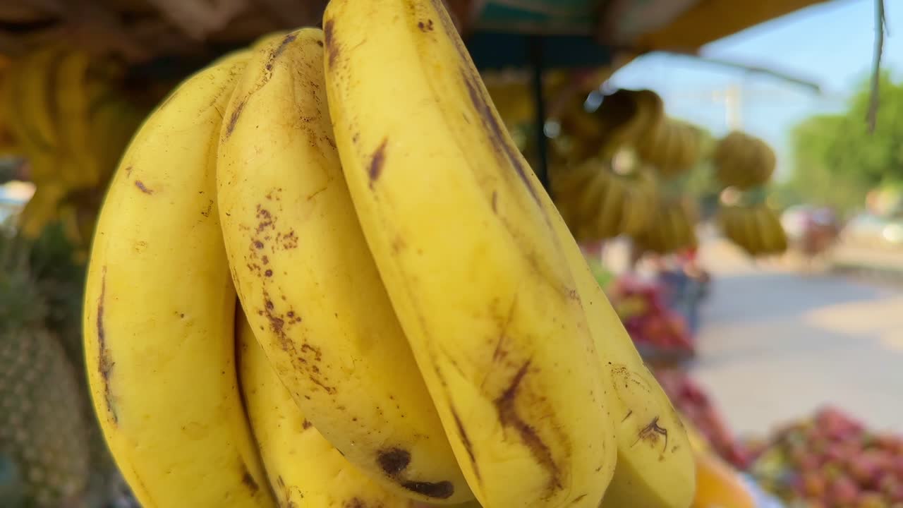 Banana in Indian market, closeup of Fresh and ripe banana for sale at street fruit shop in India