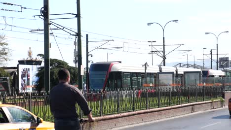 tram and taxi on a city street