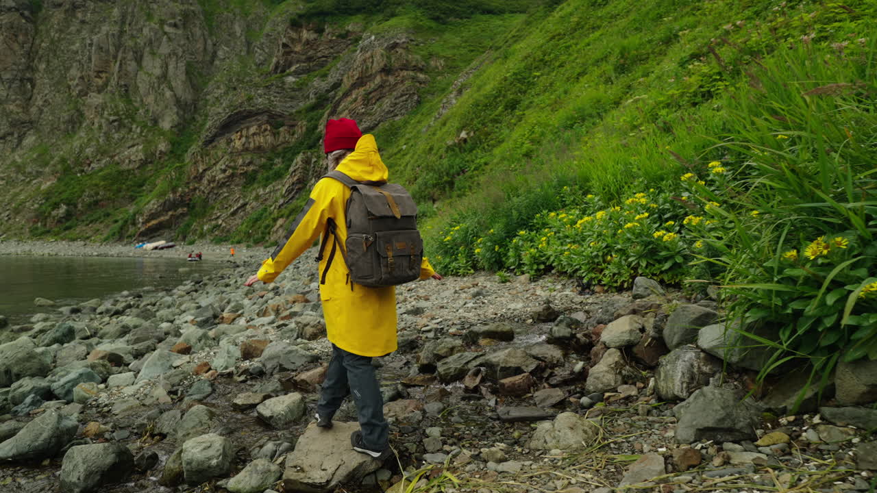 Hiker on a Rocky Coastline