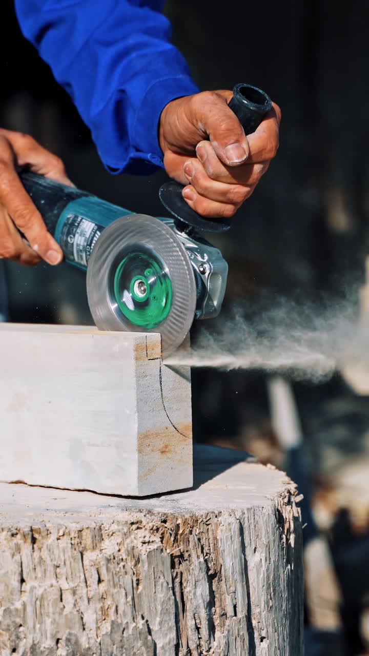 Processing of white marble. Stone processing industry with circular saw. Vertical video