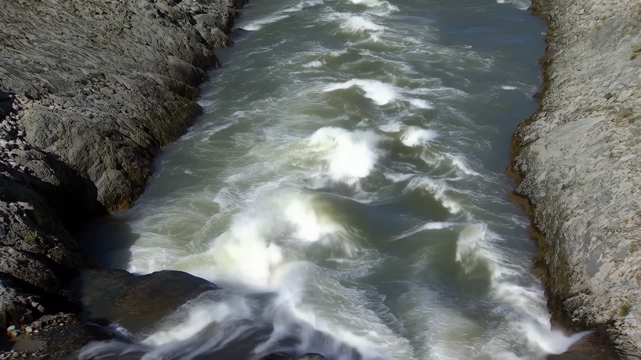 Raging River Flowing Through a Rocky Gorge