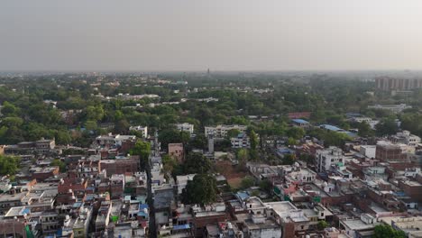 overhead shot capturing the tightly packed housing and bustling streets of varanasi, where life pulses with energy and spiritual devotion.