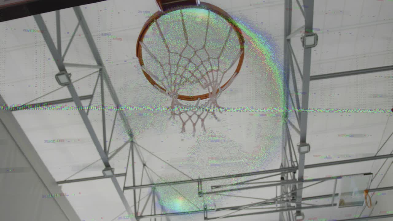 Player driving ball from lower left, guiding dunk through hoop, stretching net in sports training