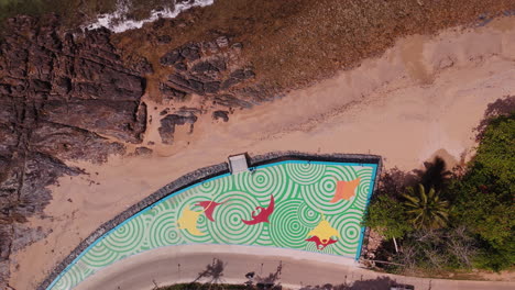 colorful coastal mural from above