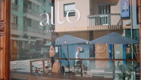 woman relaxing in a cafe terrace