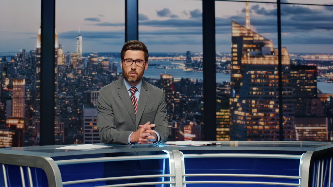 Bearded anchor man talking at newscast multimedia channel closeup. Daily news