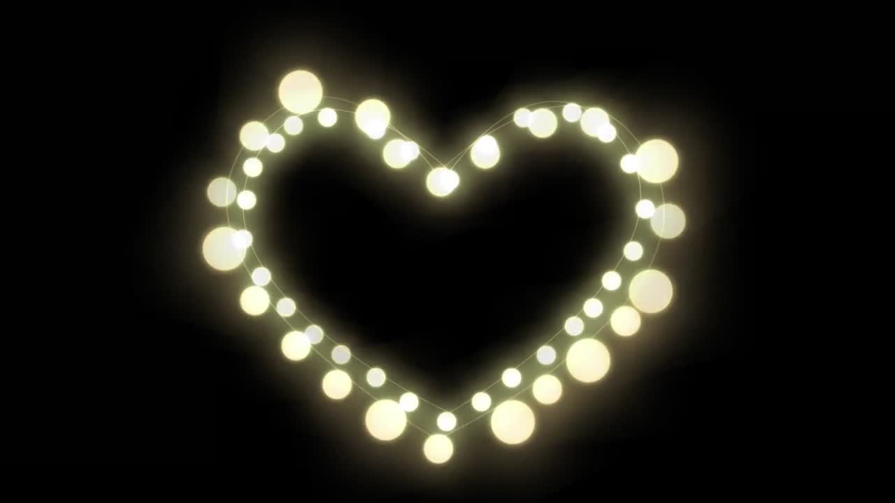 animación de luces de hadas brillantes corazón con espacio de copia en fondo negro
