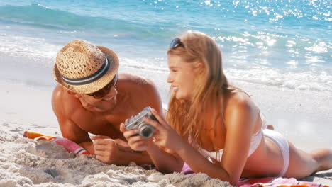 happy couple relaxing on the beach