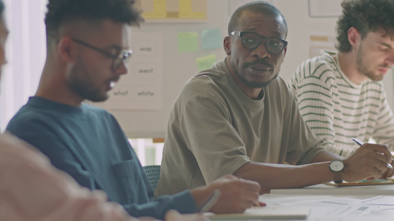 Migrant Students Having Discussion during Exam