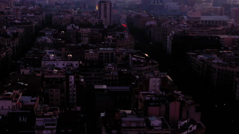 aerial view of square blocks in new quarter of barcelona at sunrise, spain