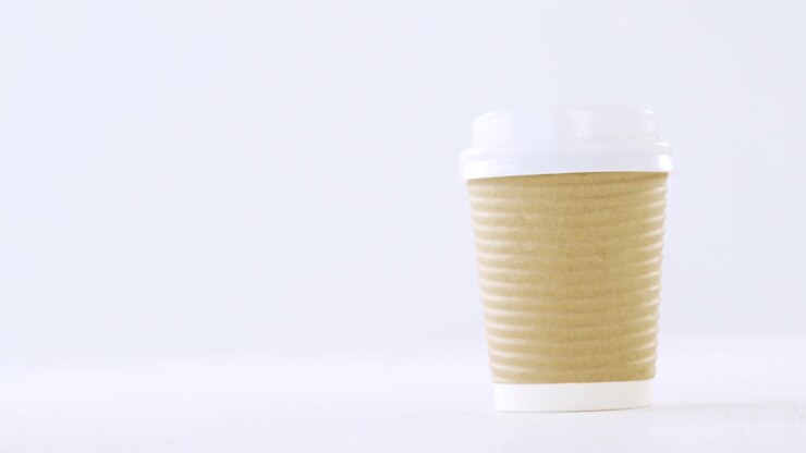 Disposable coffee cup on white background