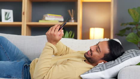 Relaxed-man-texting-on-his-phone